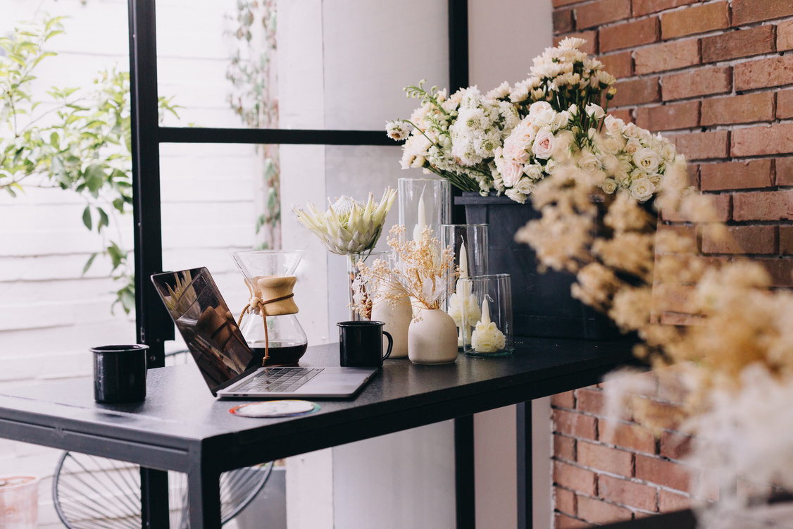 Laptop, Flowers, Vases, and Ornaments at a Flower Shop