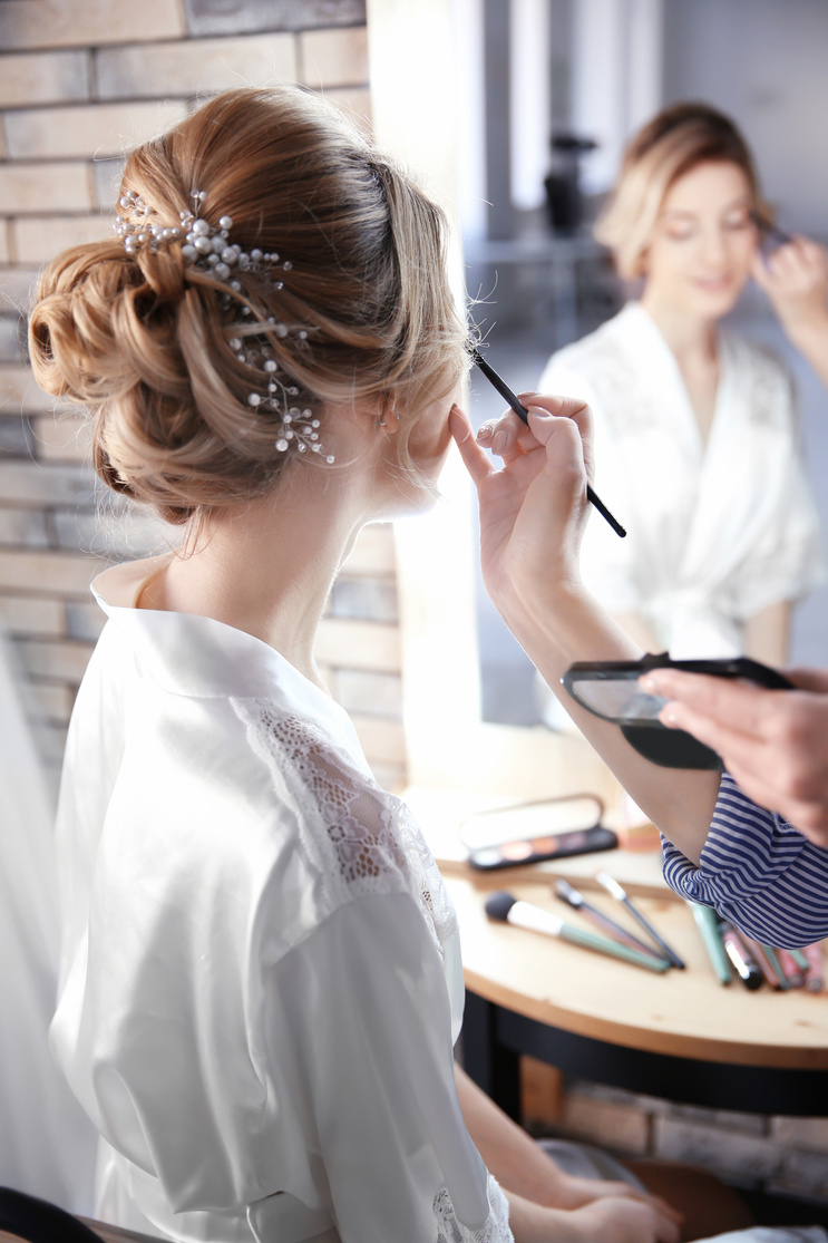 Makeup Artist Preparing Bride for Her Wedding in Room