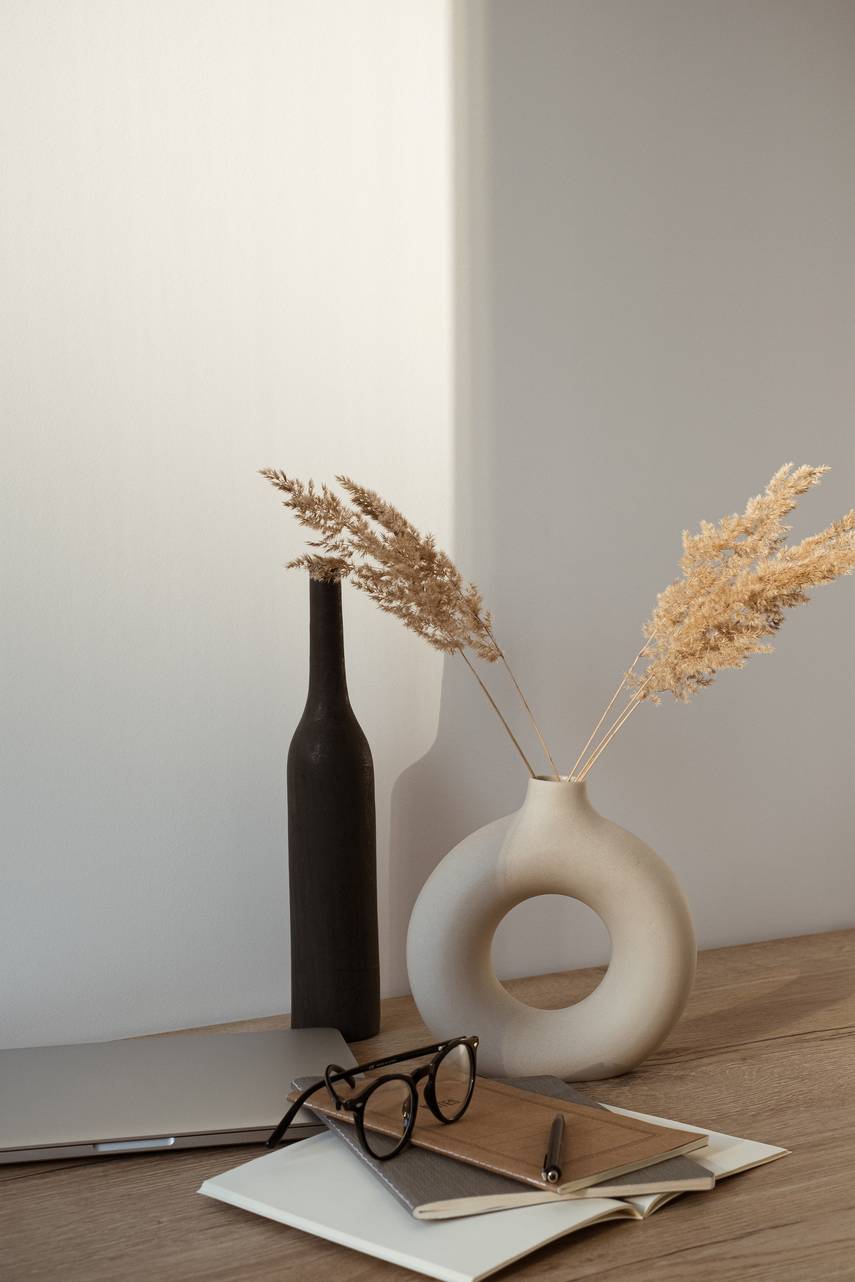 Home Office Desk with Laptop, Notebooks and Pampas Grass