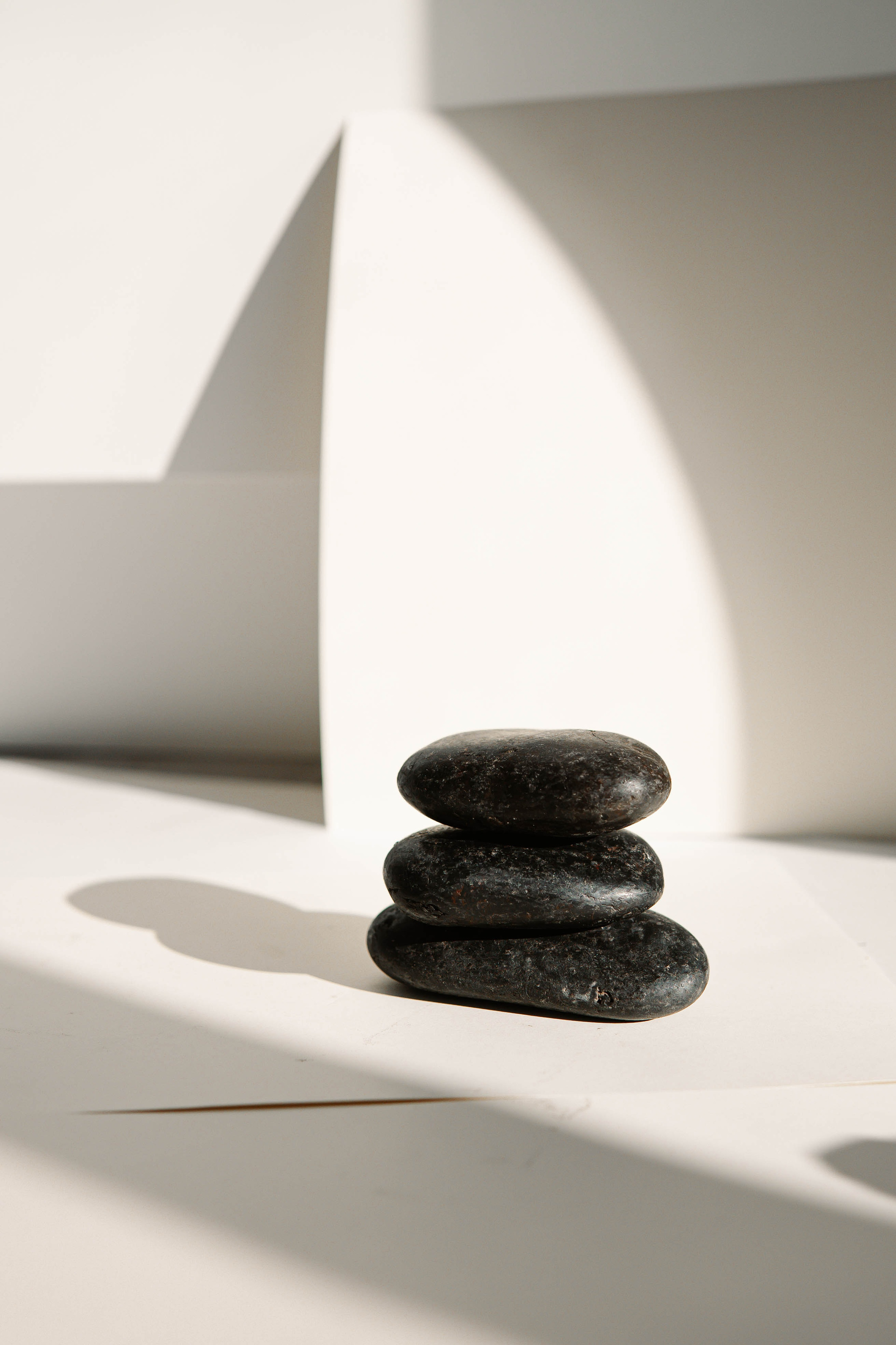 Black Stones on White Table